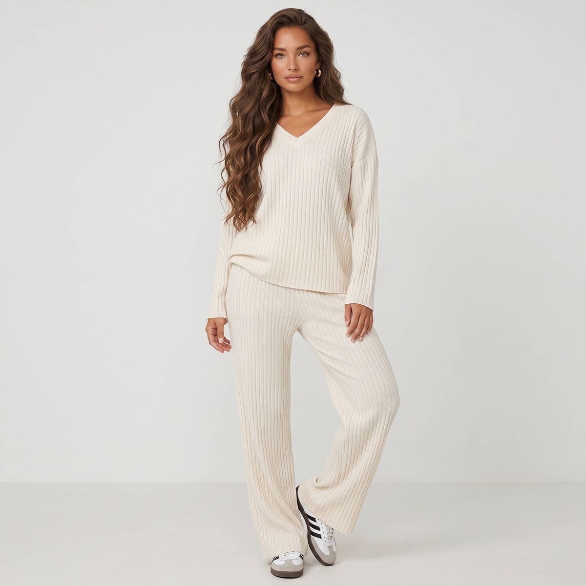 Front view of relaxed cream ribbed knit pajama set showing vertical knit texture and loose silhouette